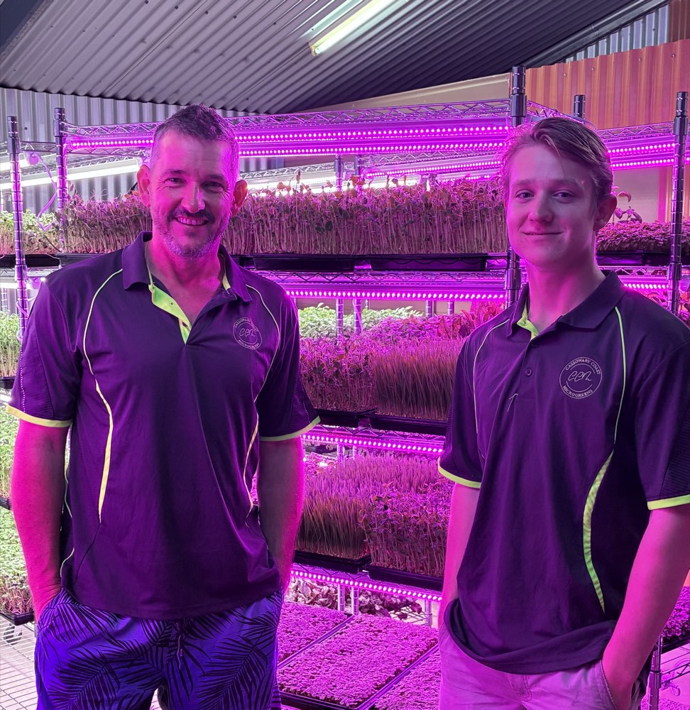 Mark and Kane Rowe in their indoor microgreens farm in Feluga QLD